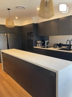 Kitchen island and dark cabinetry